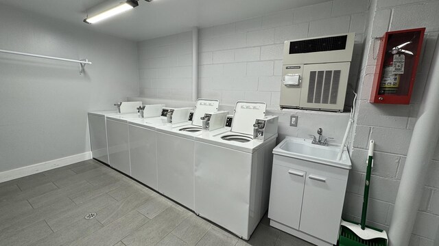2050 Valencia Dr Unit 405, Northbrook, IL 60062 - shared laundry room featuring washing machine and clothes dryer and concrete block wall