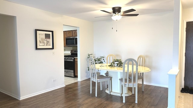 2050 Valencia Dr Unit 405, Northbrook, IL 60062 - dining room featuring ceiling fan, wood finished floors, and baseboards