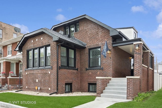 7440 S Oglesby Ave, Chicago, IL 60649 - view of property exterior featuring brick siding and a lawn