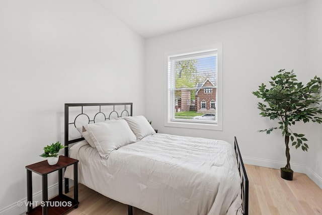 7440 S Oglesby Ave, Chicago, IL 60649 - bedroom featuring wood finished floors and baseboards
