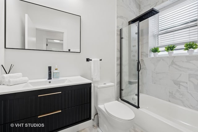 7440 S Oglesby Ave, Chicago, IL 60649 - full bathroom with marble finish flooring, toilet, vanity, and enclosed tub / shower combo