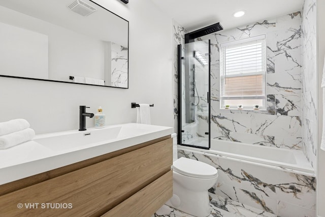 7440 S Oglesby Ave, Chicago, IL 60649 - full bath with marble look tile flooring, vanity, toilet, a combined bath / shower with marble appearance, and recessed lighting