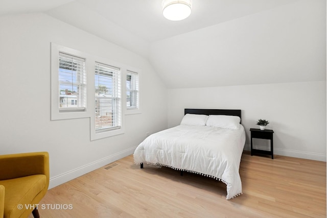 7440 S Oglesby Ave, Chicago, IL 60649 - bedroom featuring vaulted ceiling, wood finished floors, and baseboards