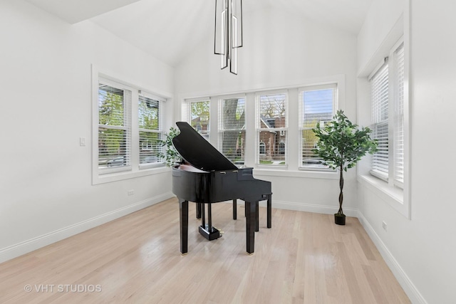 7440 S Oglesby Ave, Chicago, IL 60649 - sitting room featuring light wood finished floors, vaulted ceiling, and baseboards