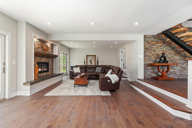 6517 Saddle Ridge Ct, Long Grove, IL 60047 - living area featuring a stone fireplace, wood finished floors, baseboards, and recessed lighting