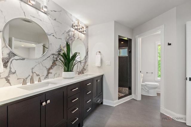 6517 Saddle Ridge Ct, Long Grove, IL 60047 - full bath with baseboards, toilet, double vanity, a stall shower, and tasteful backsplash