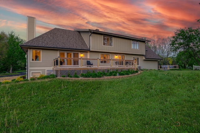 6517 Saddle Ridge Ct, Long Grove, IL 60047 - rear view of property with a chimney, a deck, a yard, and a shingled roof