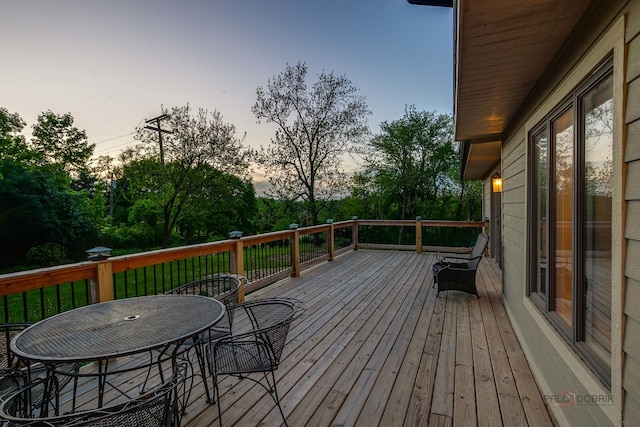 6517 Saddle Ridge Ct, Long Grove, IL 60047 - deck at dusk featuring view of scattered trees and outdoor dining space