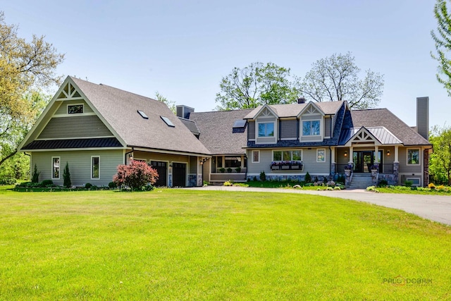 6517 Saddle Ridge Ct, Long Grove, IL 60047 - craftsman inspired home with a chimney, a front lawn, a porch, and a shingled roof