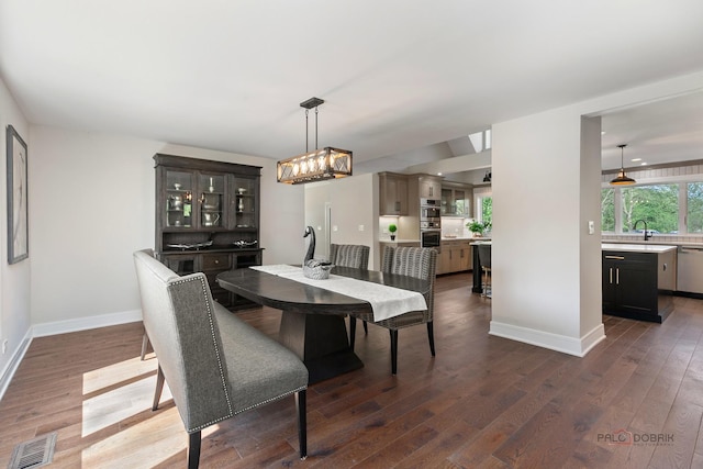 6517 Saddle Ridge Ct, Long Grove, IL 60047 - dining room with a chandelier, dark wood finished floors, and baseboards