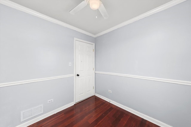 unfurnished room featuring baseboards, ornamental molding, visible vents, ceiling fan, and wood finished floors