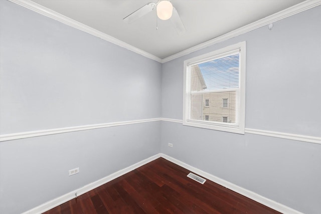 unfurnished room with crown molding, ceiling fan, dark wood finished floors, visible vents, and baseboards
