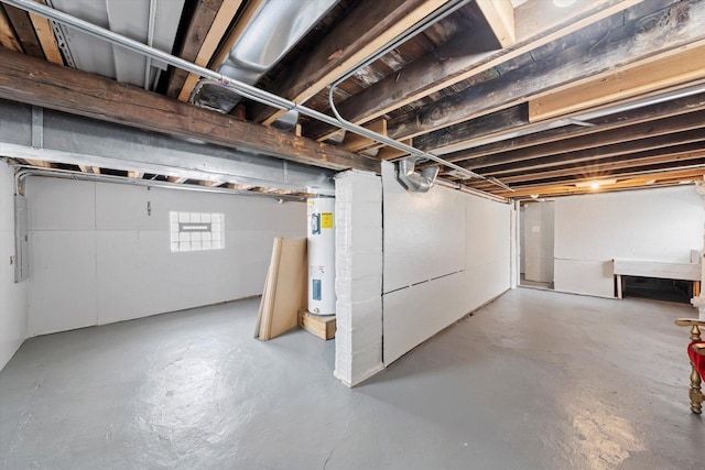 below grade area featuring electric panel and water heater