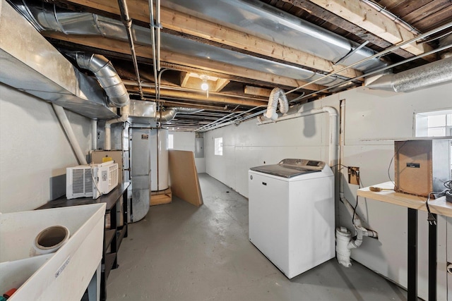 basement featuring washer / dryer and electric panel