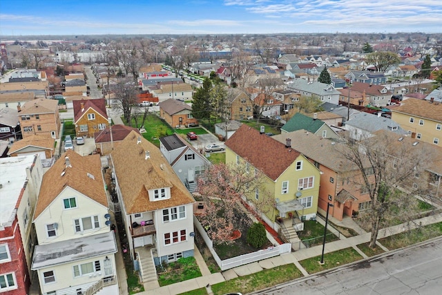 birds eye view of property with a residential view