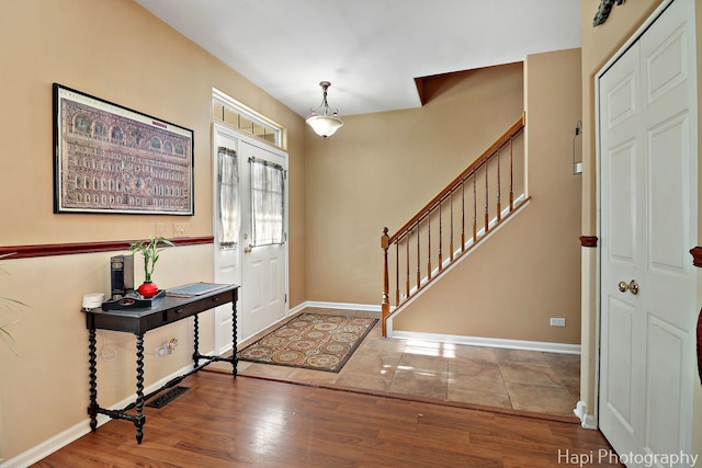 437 Deer Run Rd, Lakemoor, IL 60051 - entryway with stairs, wood finished floors, and baseboards