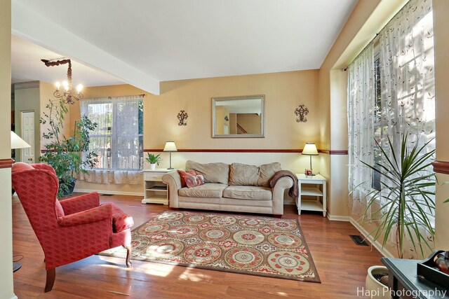 437 Deer Run Rd, Lakemoor, IL 60051 - living room with wood finished floors, baseboards, and a chandelier