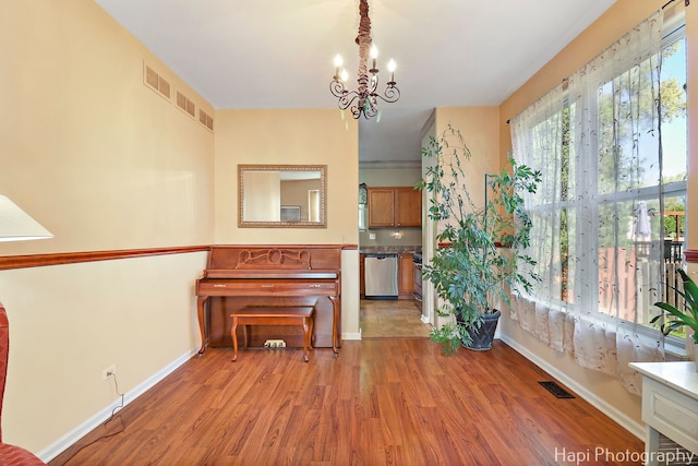 437 Deer Run Rd, Lakemoor, IL 60051 - living area with light wood finished floors, a chandelier, and baseboards