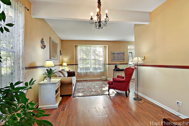 437 Deer Run Rd, Lakemoor, IL 60051 - living area with beam ceiling, wood finished floors, baseboards, and a chandelier