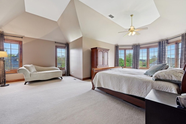 bedroom with vaulted ceiling, light carpet, baseboards, and a ceiling fan