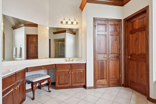 full bath with crown molding, a shower stall, vanity, and baseboards