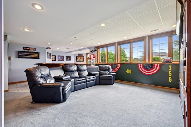living room with carpet, plenty of natural light, baseboards, recessed lighting, and a paneled ceiling