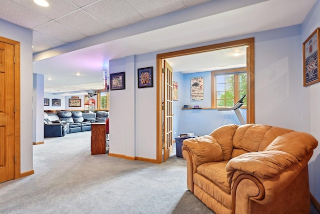 sitting room featuring carpet, baseboards, and recessed lighting