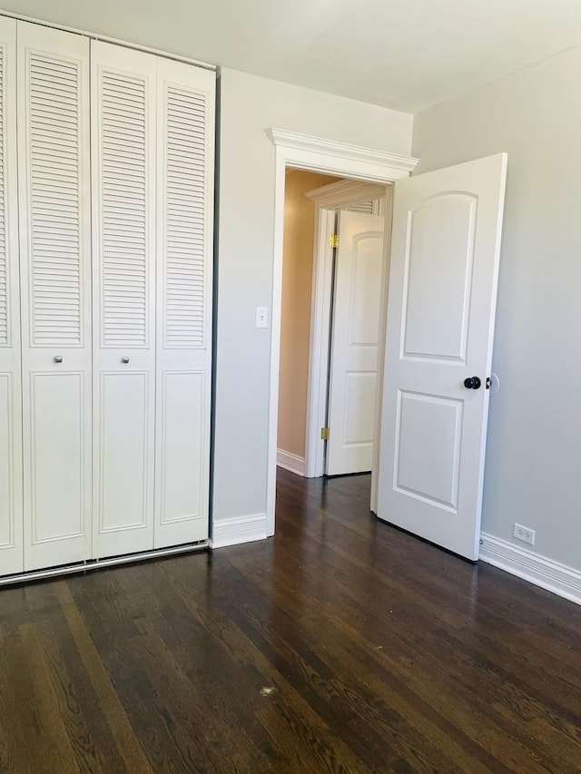 11362 S Laflin St, Chicago, IL 60643 - unfurnished bedroom with baseboards, dark wood-style flooring, and a closet