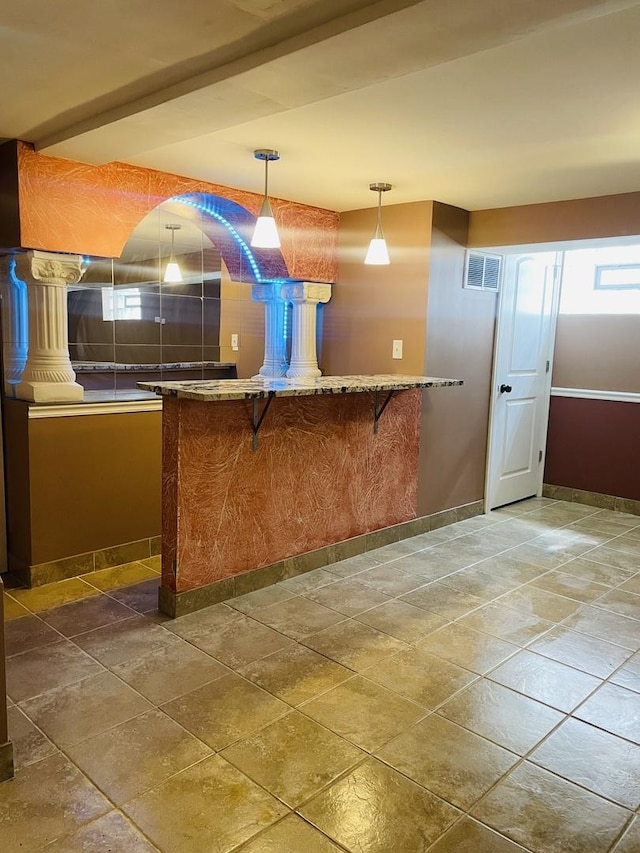 11362 S Laflin St, Chicago, IL 60643 - bar area featuring stone tile floors, baseboards, and pendant lighting