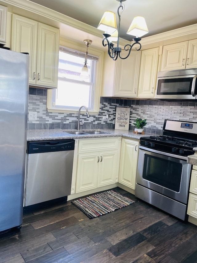 11362 S Laflin St, Chicago, IL 60643 - kitchen featuring appliances with stainless steel finishes, a sink, decorative backsplash, and a chandelier