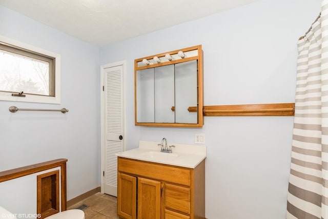 full bath featuring vanity, tile patterned flooring, visible vents, toilet, and baseboards