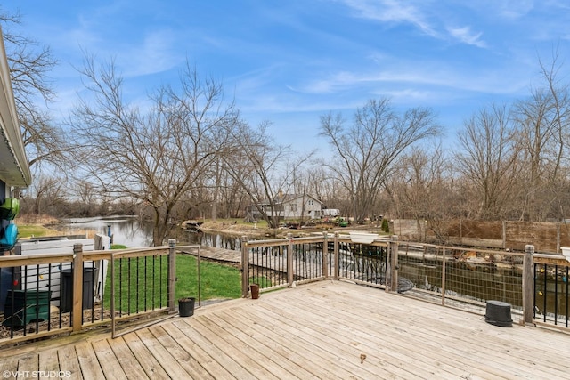 deck featuring a yard and a water view