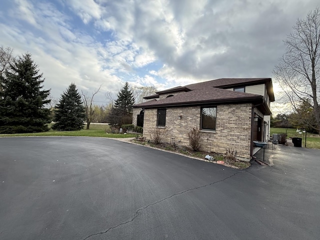 2 Rutgers Ct, Hawthorn Woods, IL 60047 - view of home's exterior featuring brick siding and roof with shingles