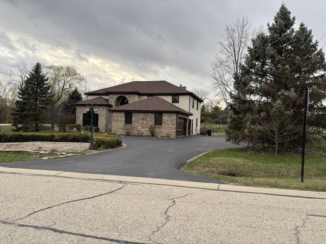 2 Rutgers Ct, Hawthorn Woods, IL 60047 - view of front facade with driveway, roof with shingles, and stone siding