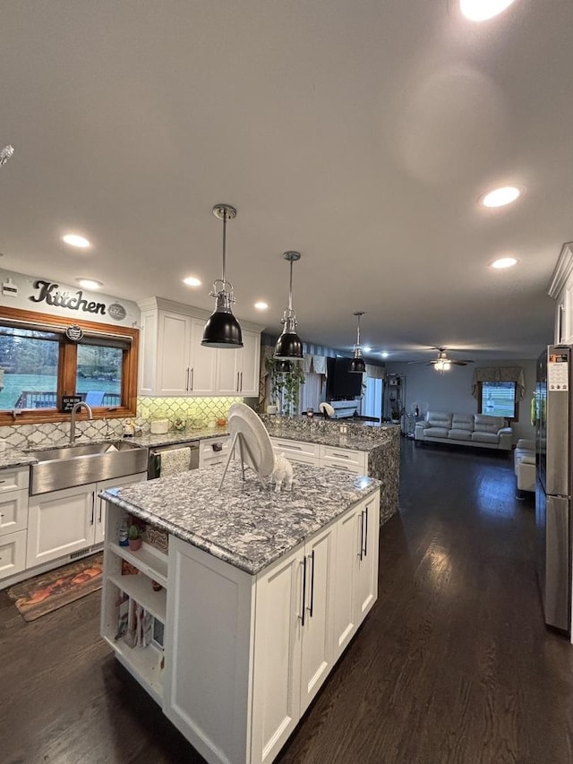 2 Rutgers Ct, Hawthorn Woods, IL 60047 - kitchen featuring a sink, white cabinets, stainless steel appliances, open floor plan, and recessed lighting