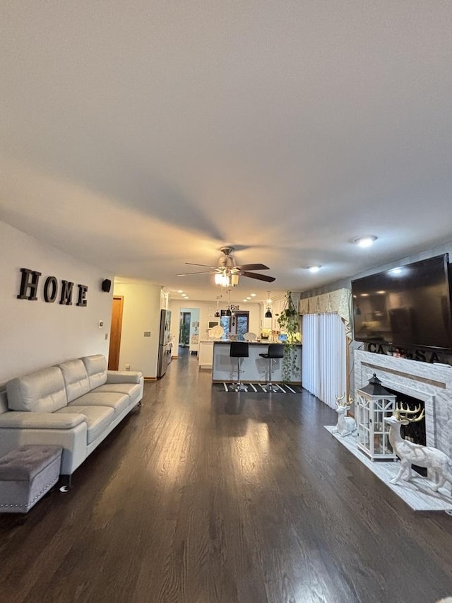 2 Rutgers Ct, Hawthorn Woods, IL 60047 - living room featuring a ceiling fan, dark wood-style flooring, and a fireplace with flush hearth