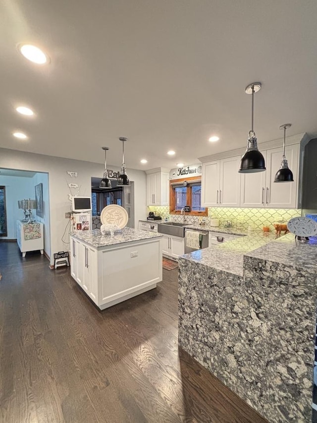 2 Rutgers Ct, Hawthorn Woods, IL 60047 - kitchen with stainless steel dishwasher, dark wood-style floors, white cabinetry, light stone counters, and decorative backsplash