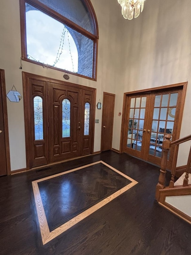 2 Rutgers Ct, Hawthorn Woods, IL 60047 - foyer entrance featuring a high ceiling, wood finished floors, french doors, a chandelier, and baseboards