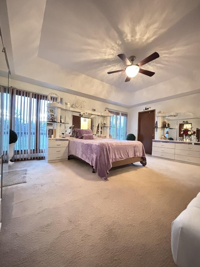 2 Rutgers Ct, Hawthorn Woods, IL 60047 - carpeted bedroom with a raised ceiling, multiple windows, and a ceiling fan