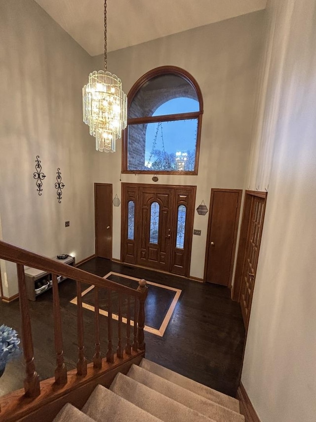 2 Rutgers Ct, Hawthorn Woods, IL 60047 - entryway featuring a chandelier, baseboards, a high ceiling, stairs, and wood finished floors