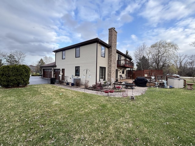 2 Rutgers Ct, Hawthorn Woods, IL 60047 - back of property with a chimney, a yard, a balcony, asphalt driveway, and a patio area