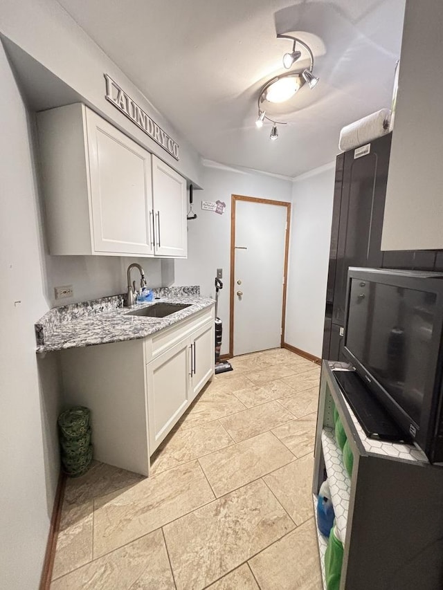 2 Rutgers Ct, Hawthorn Woods, IL 60047 - kitchen featuring a sink, white cabinets, light stone counters, and baseboards