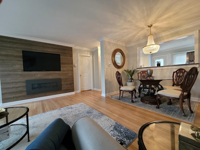8416 Mccormick Blvd, Skokie, IL 60076 - living room featuring an inviting chandelier, baseboards, a fireplace, and wood finished floors