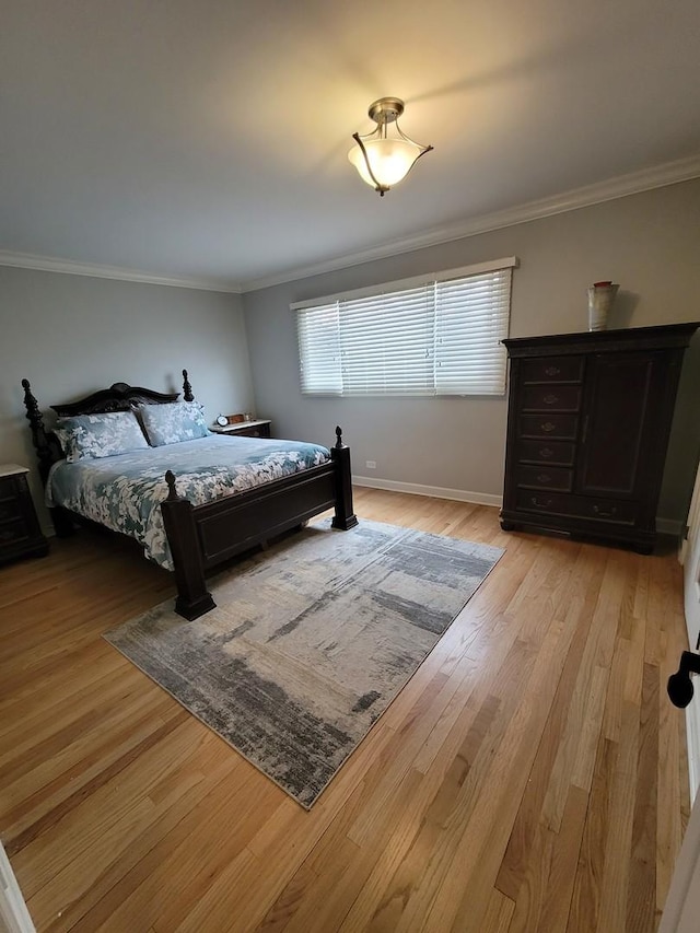 8416 Mccormick Blvd, Skokie, IL 60076 - bedroom featuring crown molding, baseboards, and light wood-style floors