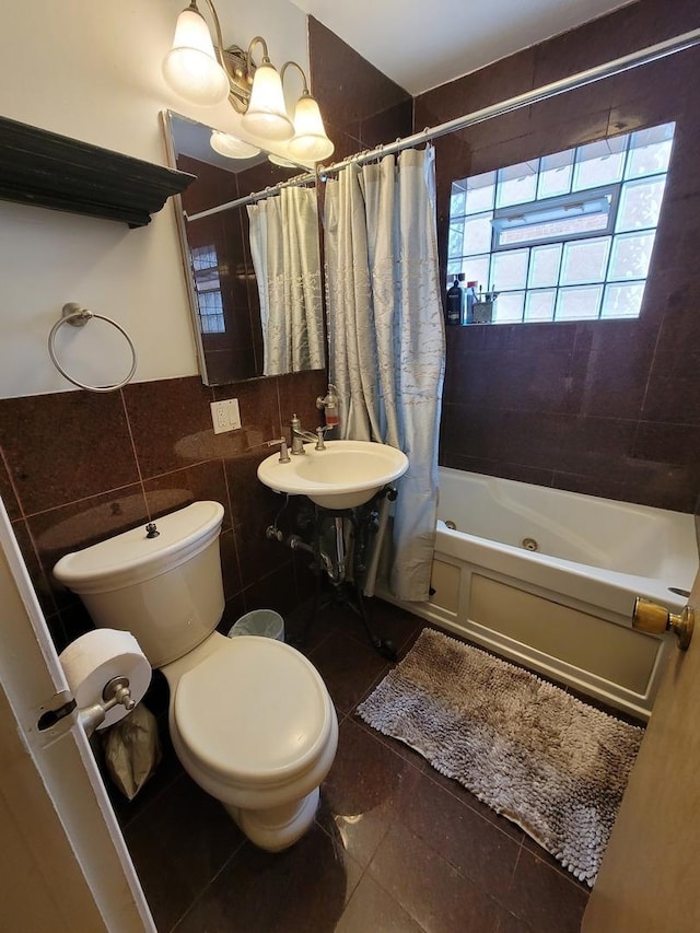 8416 Mccormick Blvd, Skokie, IL 60076 - bathroom featuring a sink, tile patterned flooring, toilet, tile walls, and shower / tub combo