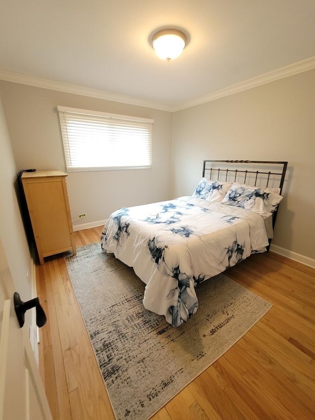 8416 Mccormick Blvd, Skokie, IL 60076 - bedroom with baseboards, ornamental molding, and light wood finished floors