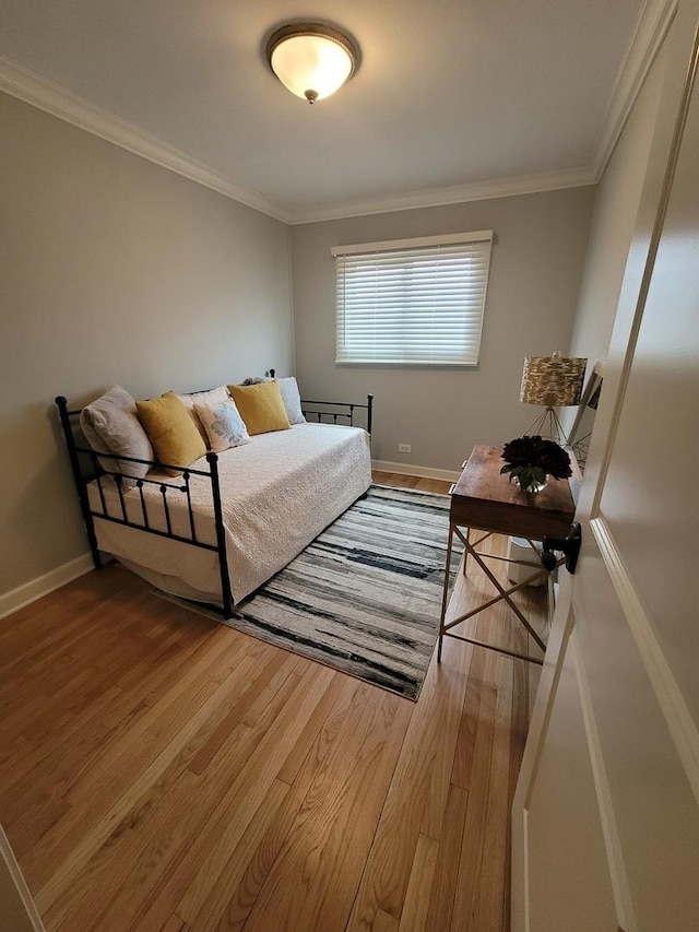 8416 Mccormick Blvd, Skokie, IL 60076 - bedroom with baseboards, ornamental molding, and wood finished floors