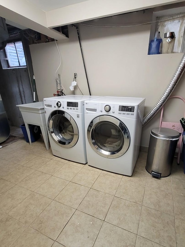 8416 Mccormick Blvd, Skokie, IL 60076 - washroom with light tile patterned flooring, laundry area, a sink, and washer and clothes dryer