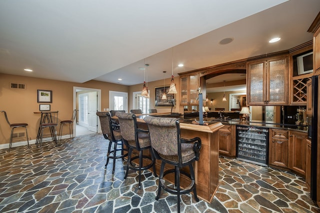 1303 Bonnema Ave, Naperville, IL 60565 - bar featuring beverage cooler, stone flooring, visible vents, and recessed lighting