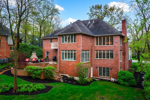 1303 Bonnema Ave, Naperville, IL 60565 - back of property with central AC, a chimney, a lawn, brick siding, and a patio area
